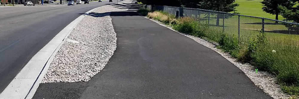 TMC crew placing hot mix asphalt